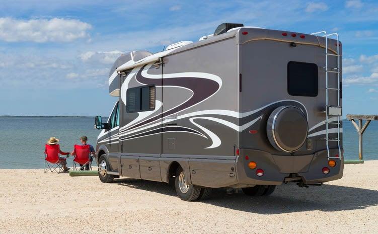 RV nestled on the beach